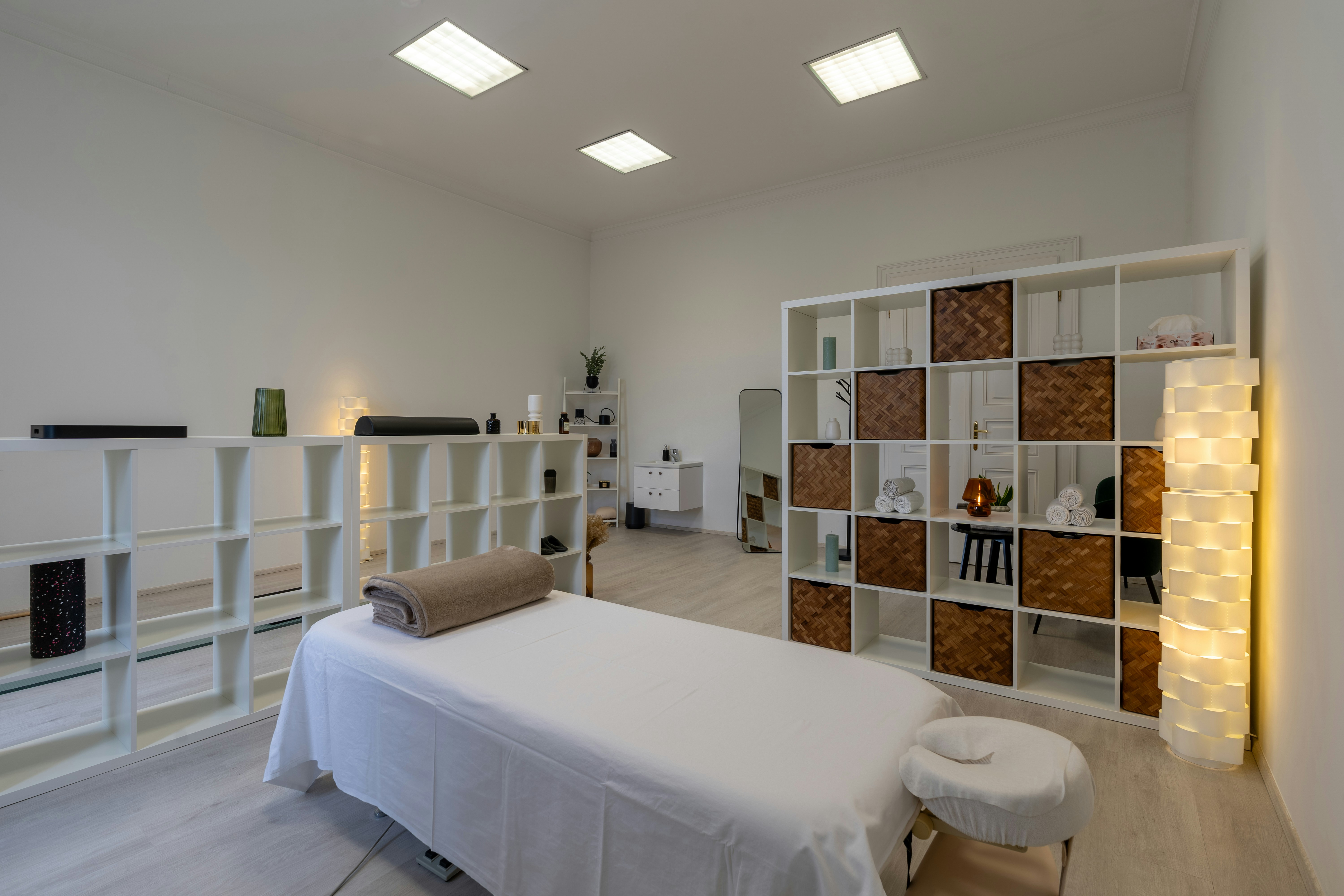 Bright, calm treatment room with a prepared table